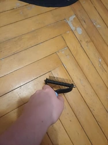 Customer photo review of Double-Sided Dog Dematting Comb & Deshedding Tool for Dogs & Cats