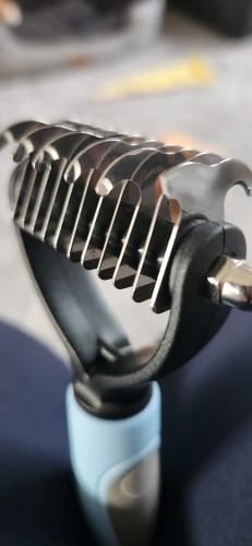 Customer photo review of Double-Sided Dog Dematting Comb & Deshedding Tool for Dogs & Cats