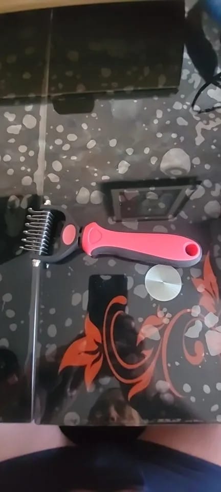 Customer photo review of Double-Sided Dog Dematting Comb & Deshedding Tool for Dogs & Cats