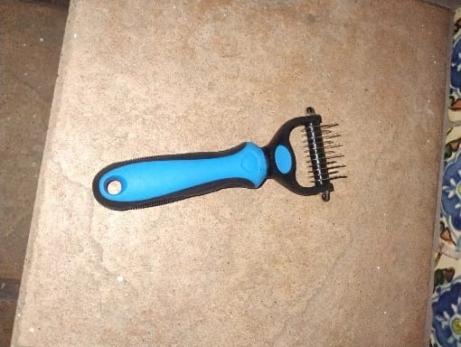 Customer photo review of Double-Sided Dog Dematting Comb & Deshedding Tool for Dogs & Cats