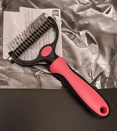 Customer photo review of Double-Sided Dog Dematting Comb & Deshedding Tool for Dogs & Cats