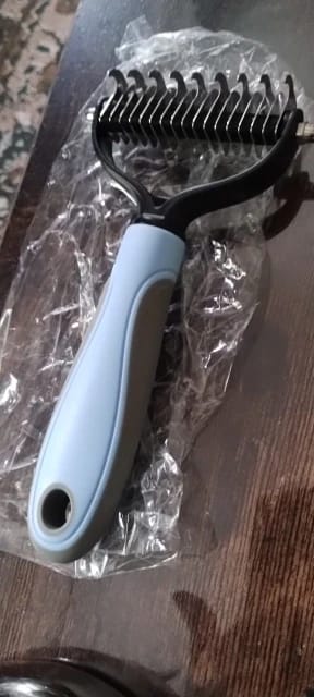 Customer photo review of Double-Sided Dog Dematting Comb & Deshedding Tool for Dogs & Cats