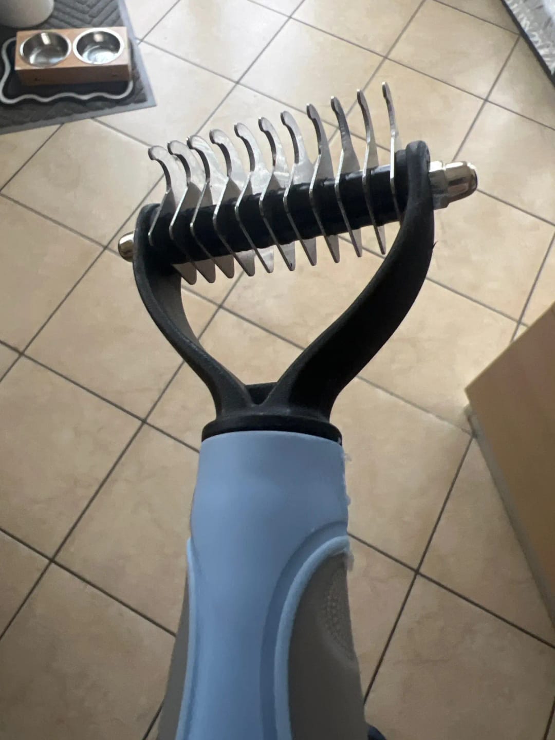 Customer photo review of Double-Sided Dog Dematting Comb & Deshedding Tool for Dogs & Cats
