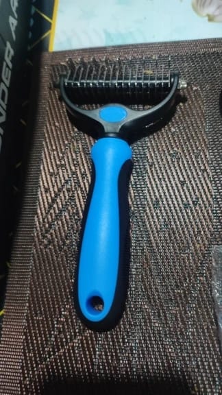 Customer photo review of Double-Sided Dog Dematting Comb & Deshedding Tool for Dogs & Cats