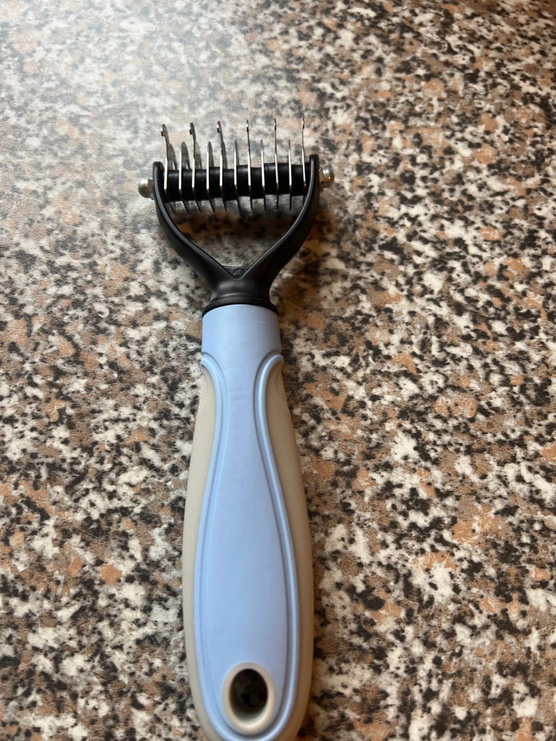 Customer photo review of Double-Sided Dog Dematting Comb & Deshedding Tool for Dogs & Cats