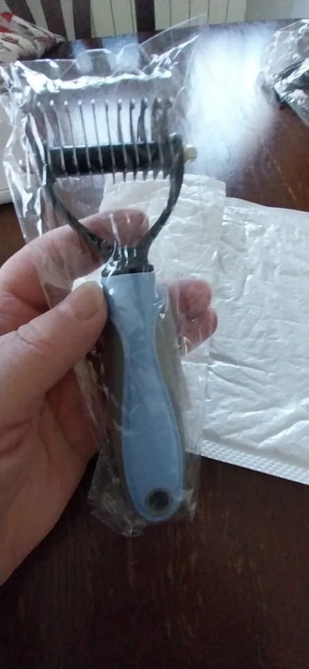 Customer photo review of Double-Sided Dog Dematting Comb & Deshedding Tool for Dogs & Cats