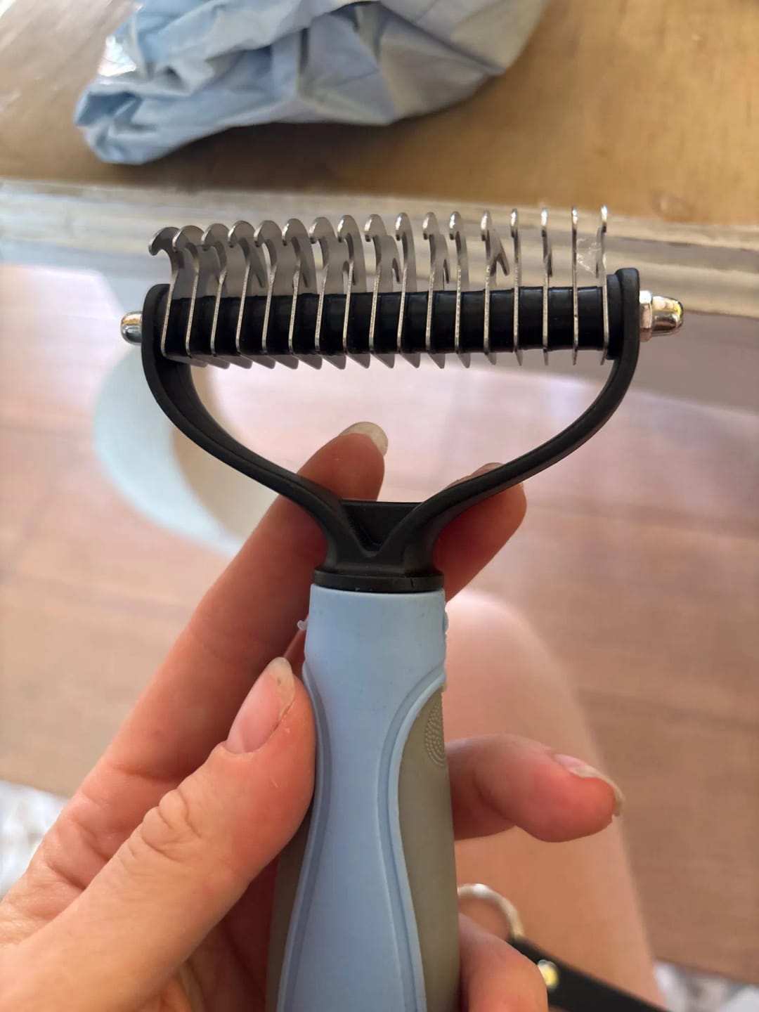 Customer photo review of Double-Sided Dog Dematting Comb & Deshedding Tool for Dogs & Cats