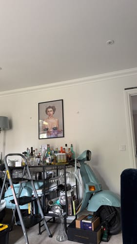 Customer's framed Majestic art print hanging on a white wall in their home.