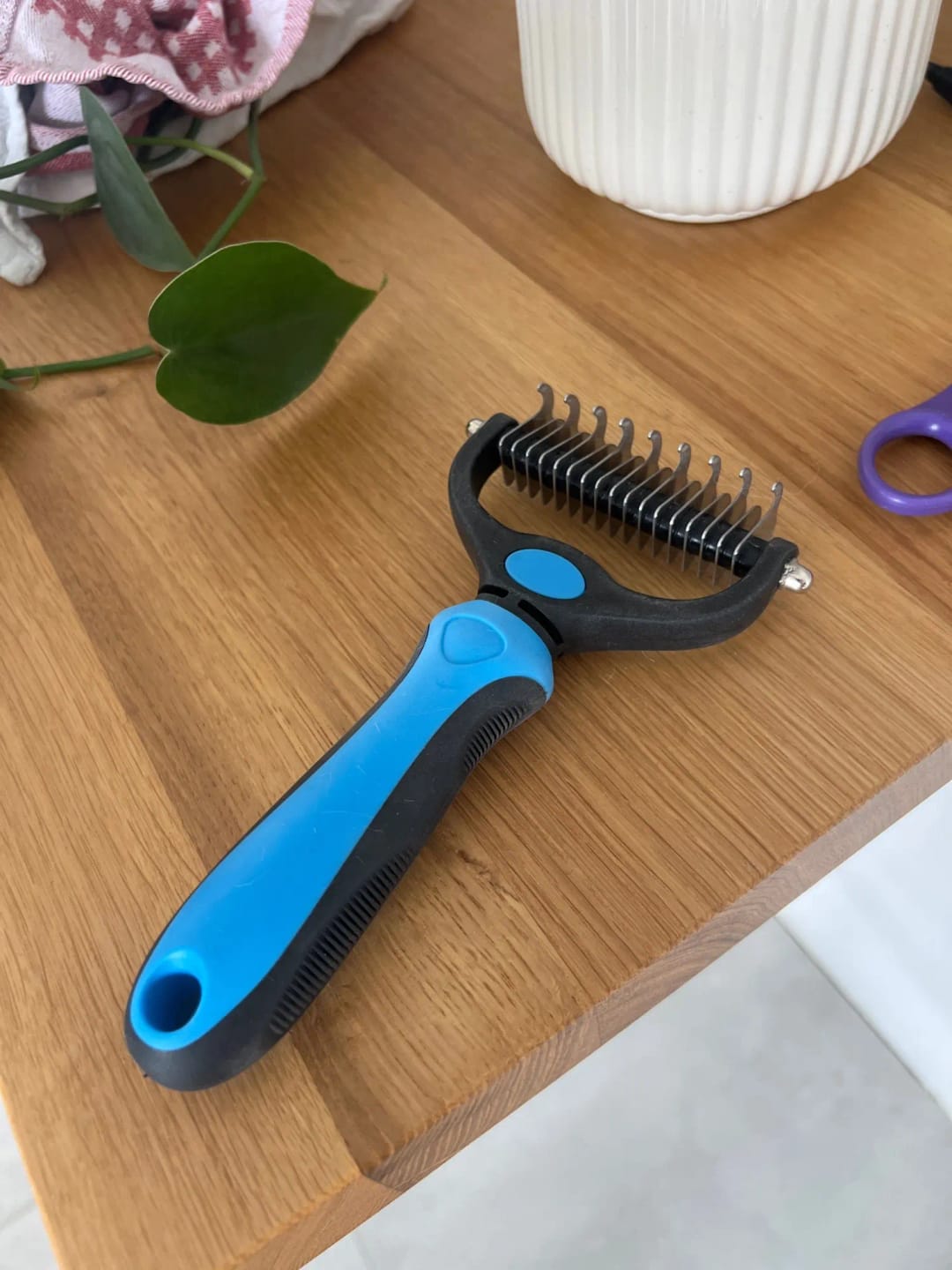 Customer photo review of Double-Sided Dog Dematting Comb & Deshedding Tool for Dogs & Cats