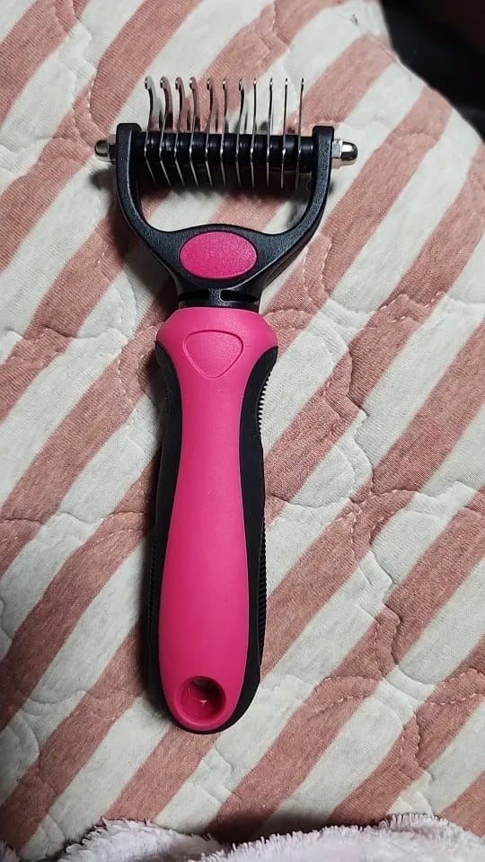 Customer photo review of Double-Sided Dog Dematting Comb & Deshedding Tool for Dogs & Cats