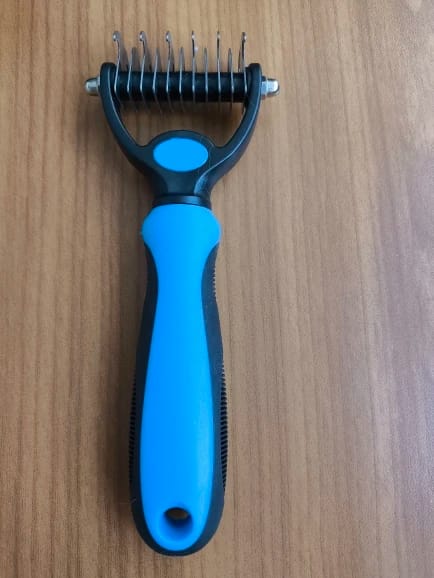 Customer photo review of Double-Sided Dog Dematting Comb & Deshedding Tool for Dogs & Cats