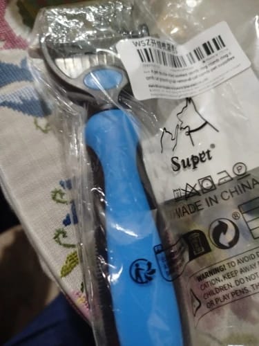 Customer photo review of Double-Sided Dog Dematting Comb & Deshedding Tool for Dogs & Cats