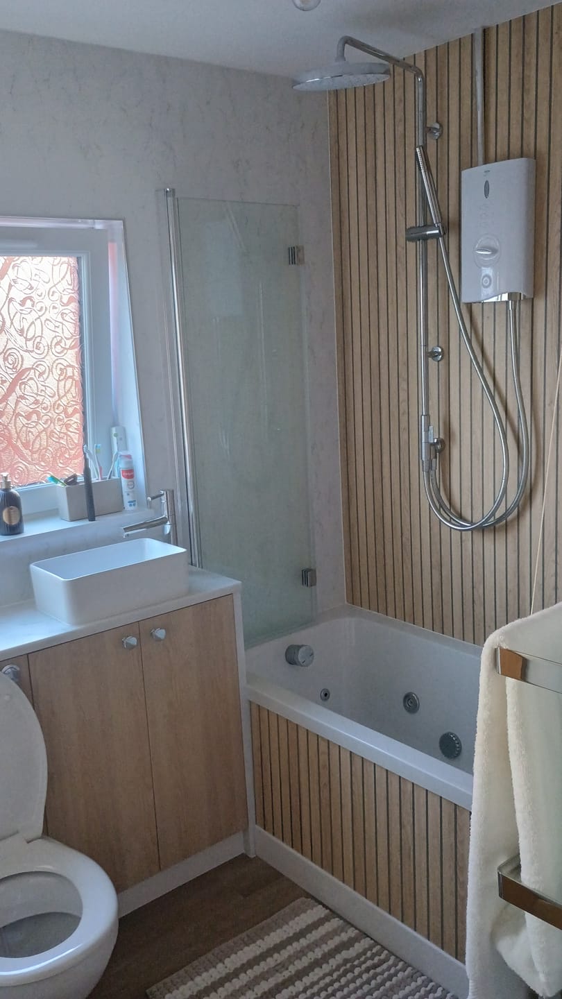 Customer photo review of Sivara Oak Slatted Wood Effect PVC Waterproof Shower Panel