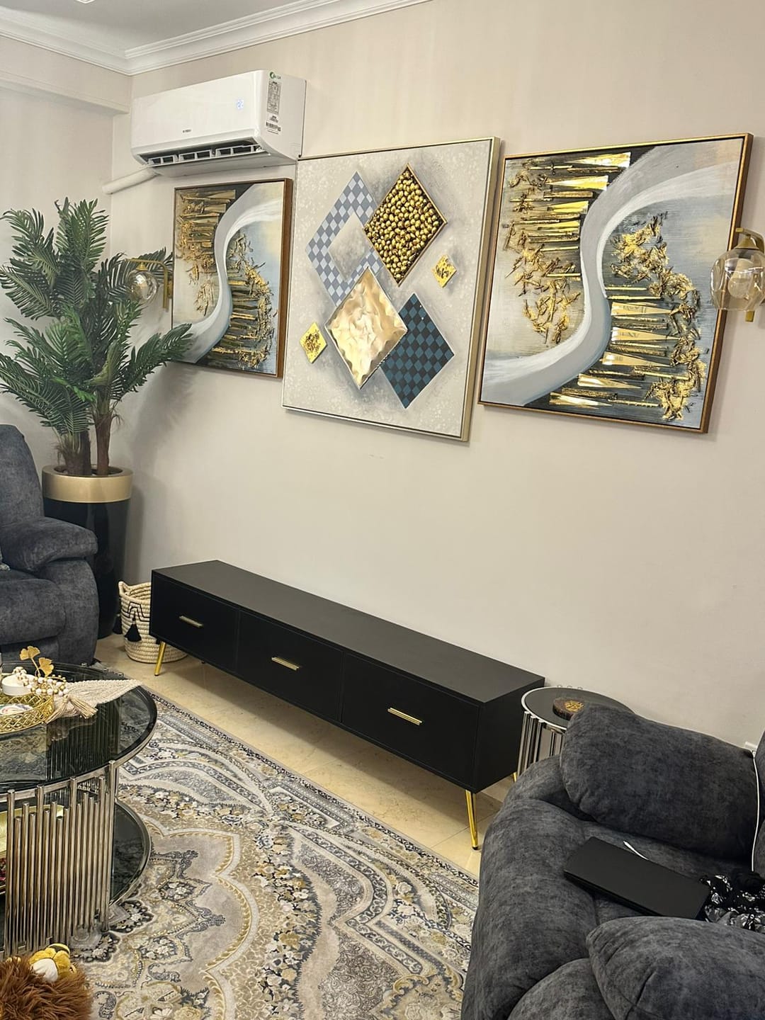 Customer photo review of Black TV stand with luxurious gold legs and handles