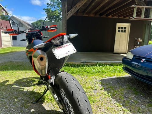 Customer's KTM 690 SMC from a low rear angle, showing the clean tail tidy and license plate holder.