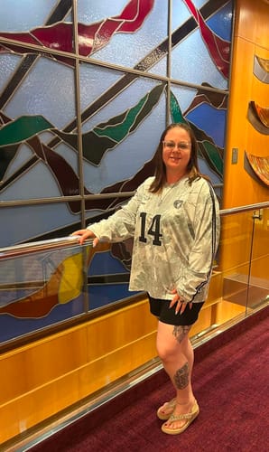 Customer wearing the oversized Camo Longsleeve Jersey indoors, showing the front with number '14'.