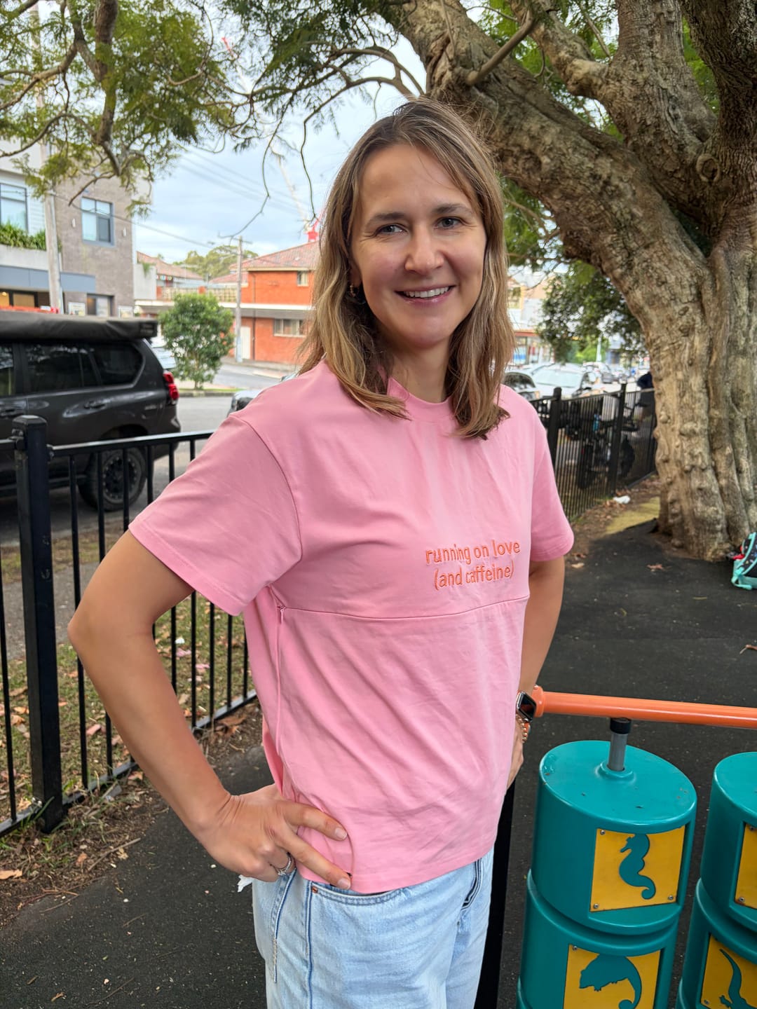 Customer photo review of Pink Breastfeeding Tee with Hidden Zip – "Running on Love (and caffeine)"