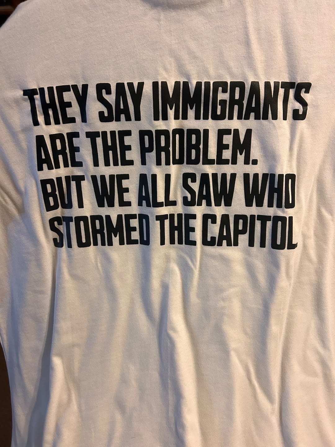 Customer photo review of They Say Immigrants Are the Problem. But We All Saw Who Stormed the Capitol Unisex Tee