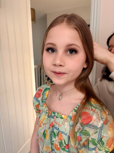Customer's daughter wearing the long, full Marriage Material Bridal Lashes for a cheer competition.