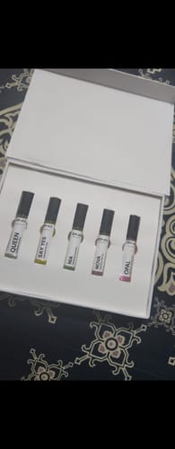 Customer's Female Tester Pack open in its white box, showing five perfume testers.