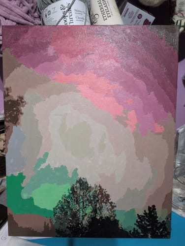 Reviewer's finished painting from the Custom Paint by Numbers Kit, showing trees beneath a colorful, abstract sky.