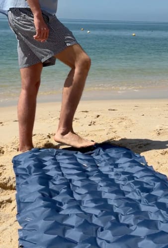 Adventure Mat on the beach with feet on sand