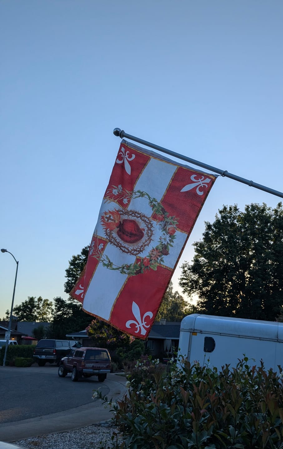 Customer photo review of Flag of the Sacred Heart – Red – Indoor/outdoor Flag – Polyester – 2x3, 3x5 and 4x6.