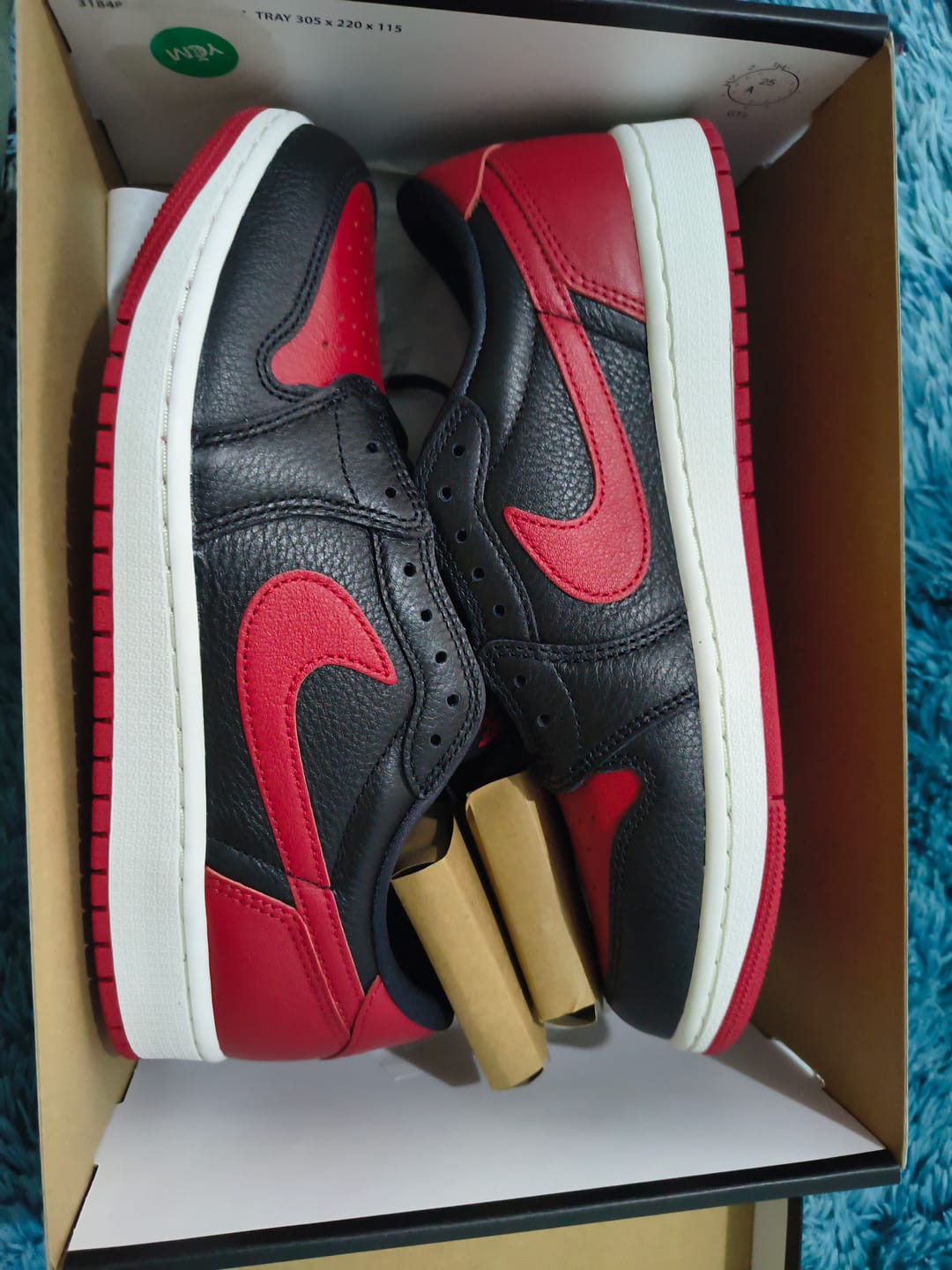 Customer photo review of Air Jordan 1 Retro Low OG "Banned" Black and Varsity Red