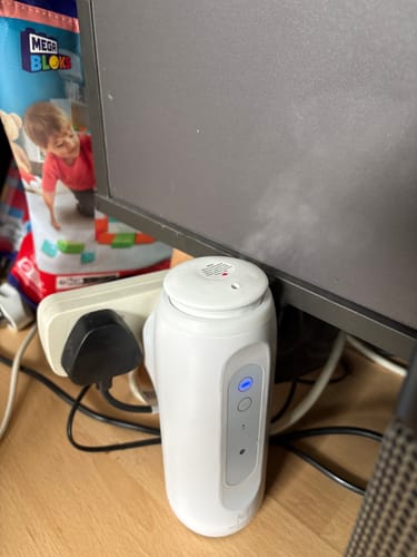 Customer's white aroma diffuser in use on a desk, emitting a mist of the Sweet Jasmine oil.