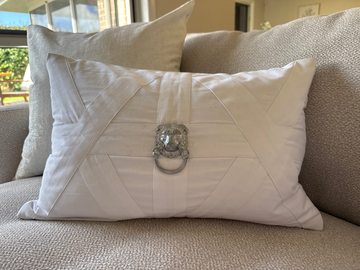 Customer photo review of Lion Head Silver White Handmade Metal Embellished Lumbar Cushion