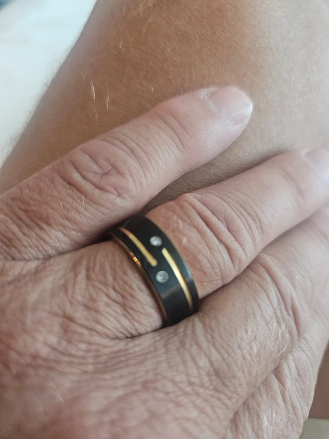 Customer photo review of Mens Black Tungsten Carbide Wedding Band with Gold Grooves 2 CZ Diamonds.