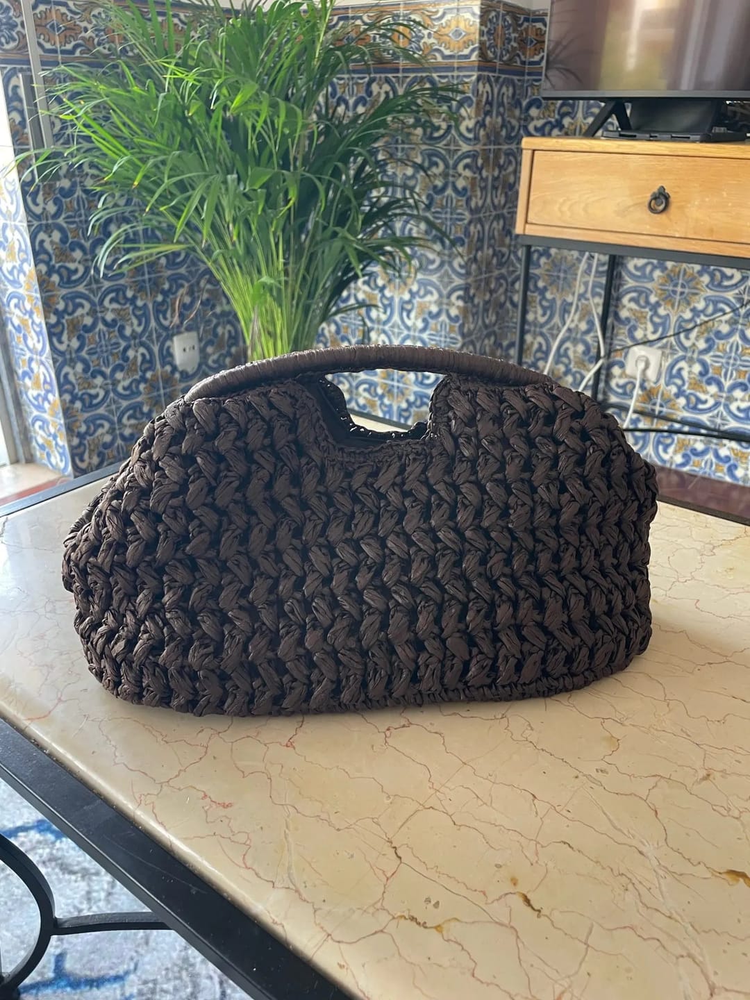 Customer photo review of Raye Woven Straw Shell Clutch