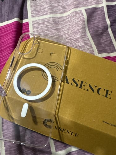 Customer's clear Casence phone case with a white magnetic ring, shown on its packaging.
