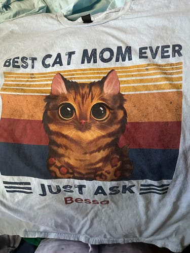 Reviewer's personalized light-blue shirt showing a cute cat graphic with text "Best Cat Mom Ever" and the name "Bessa".