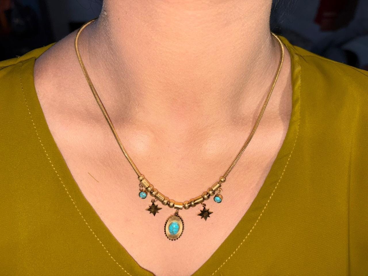 Customer photo review of Turquoise Sun Charm Statement Necklace