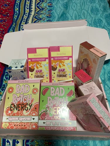 Customer's unboxed Mystery Bundle, showing a variety of P.Louise products with vibrant, colorful packaging.