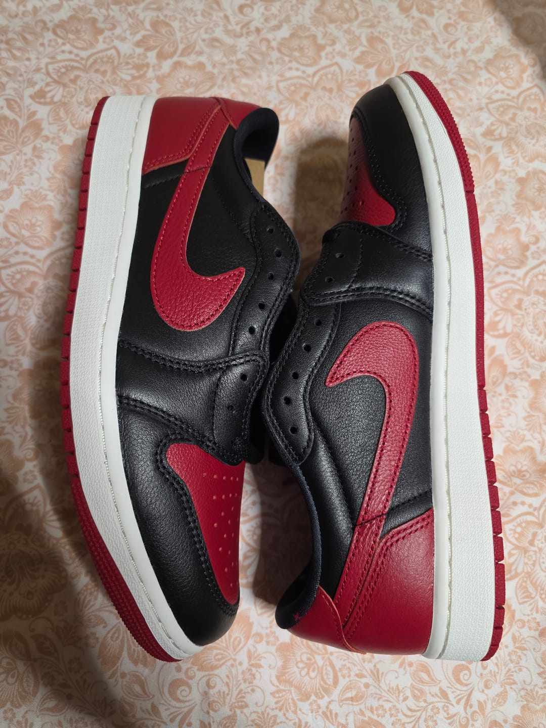 Customer photo review of Air Jordan 1 Retro Low OG "Banned" Black and Varsity Red