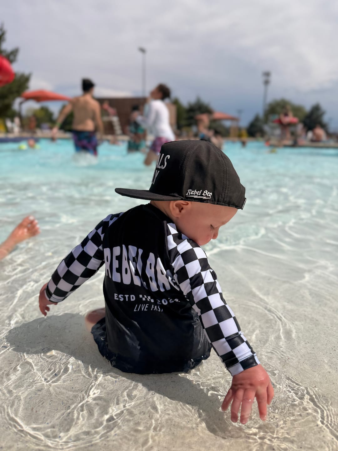 Customer photo review of UPF50+ Boys Swim Romper in Neon Electric Lime + Black Checkered