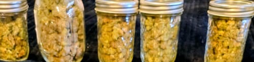 Customer's photo of several large glass jars filled with a dried product, showing a successful delivery.