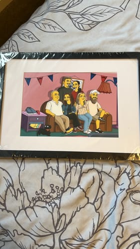 Reviewer's framed Hand Drawn Digital Portrait of a family in a yellow cartoon style, still in its plastic wrap.
