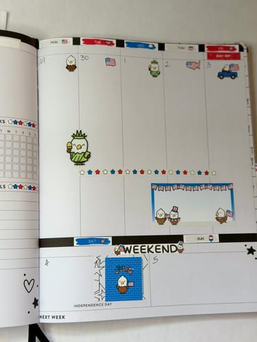 Reviewer's Hobonichi Cousin planner showing the 4th of July weekly kit with cute eagle and flag stickers.