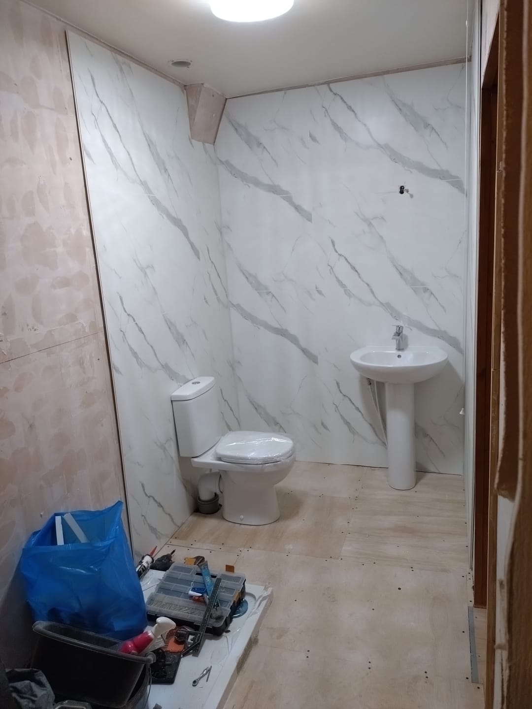 Customer photo review of 10mm Large Tile Carrara Marble Matt Shower Panel 1M x 2.4M