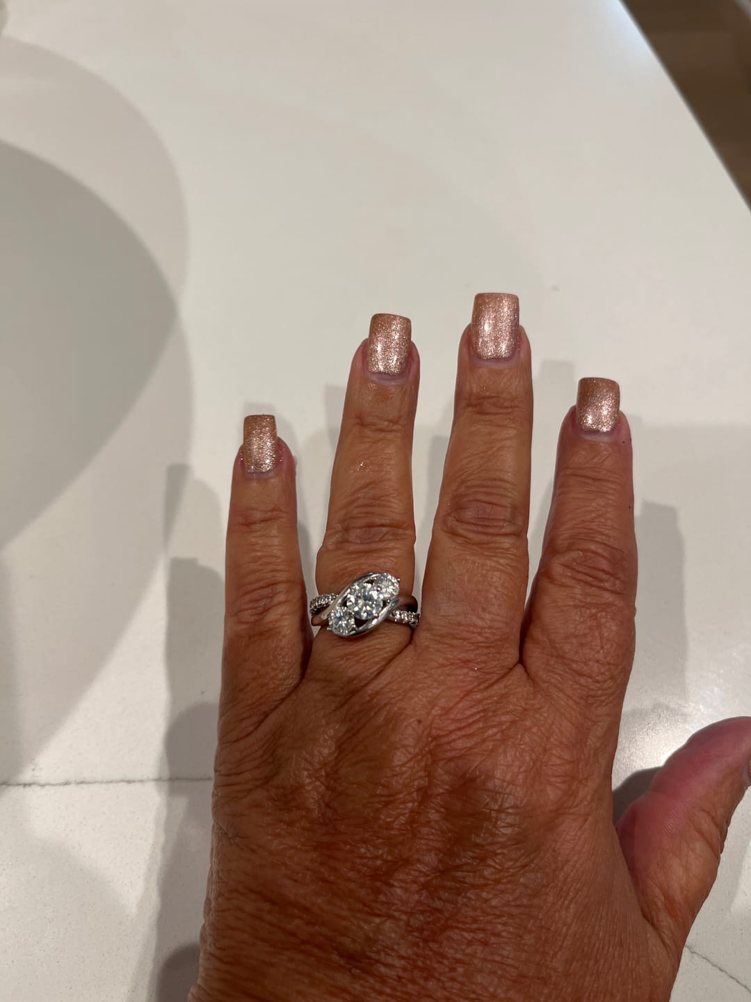 Customer photo review of Swirl Three Stone Moissanite Twisted Pave Engagement Ring