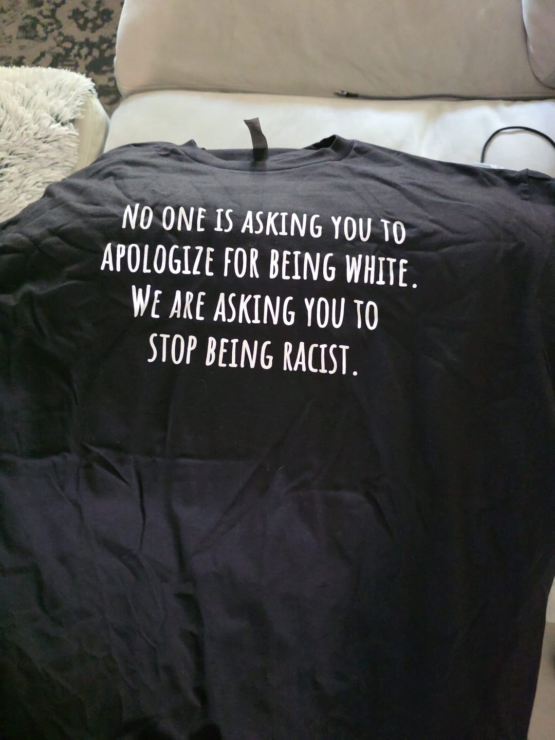 Customer photo review of If you're white in America, IMMIGRATION is your origin story Unisex Tee