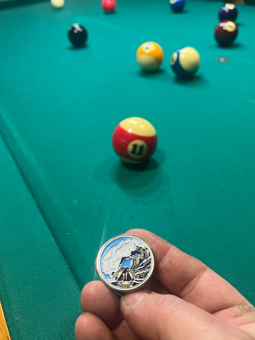 Customer photo review of 11 Year Sobriety Mint Crashing Wave Gold Plated AA Recovery Medallion - Eleven Year Chip/Coin - Blue/White
