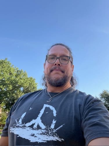 Customer wearing the Shattered Peace - Premium t-shirt, showing how it fits on a large frame.