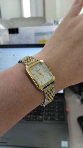 Reviewer showing their elegant CLARINE watch with a two-tone bracelet on their wrist.