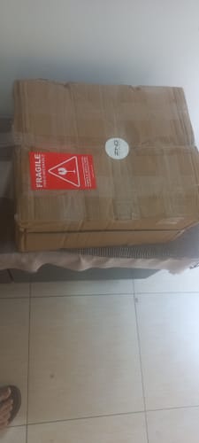 Customer's delivered box for the OUD Supreme BUNDLE, shown with a red fragile sticker.