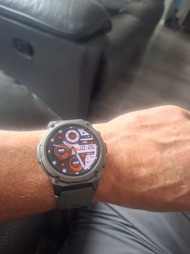 Reviewer wearing the rugged, green Gard Pro Ultra 3 watch on their wrist, showing the digital face.