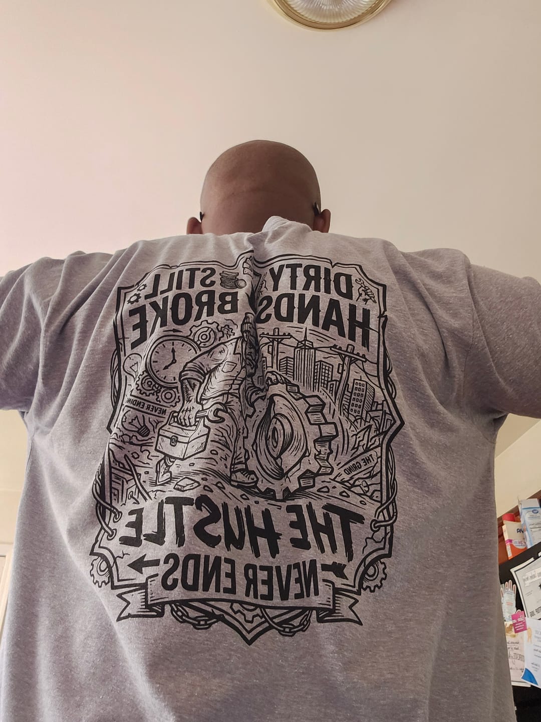 Customer photo review of Still Broke Tee